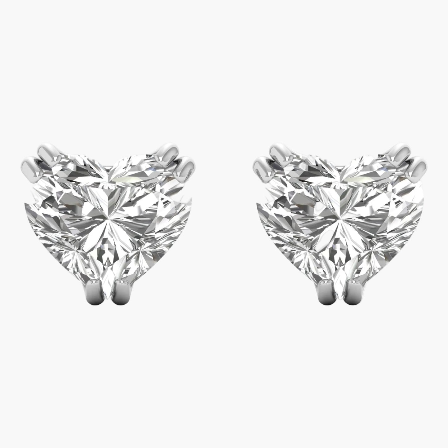 Pair of diamond stud earrings on a white background