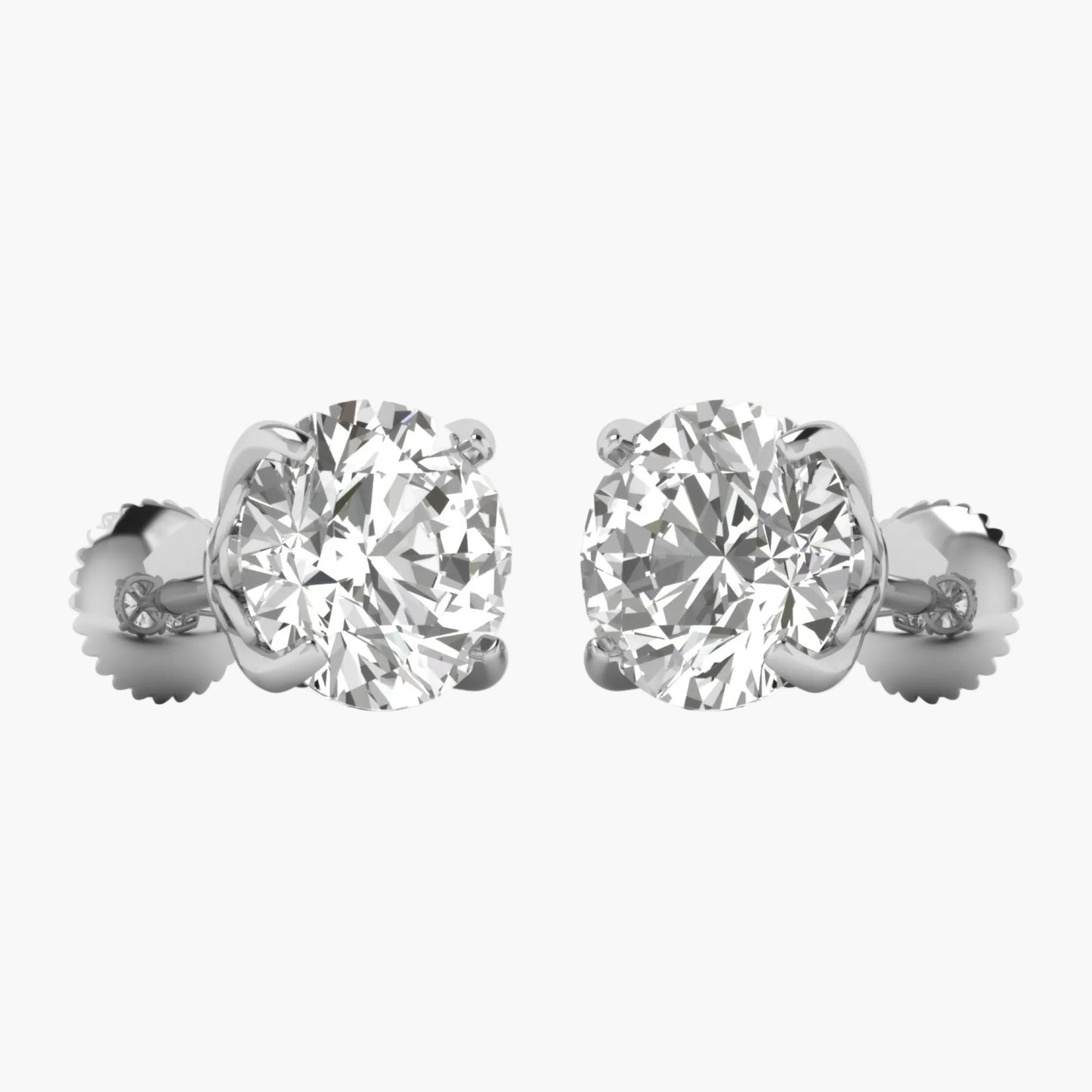 Pair of diamond stud earrings on a white background