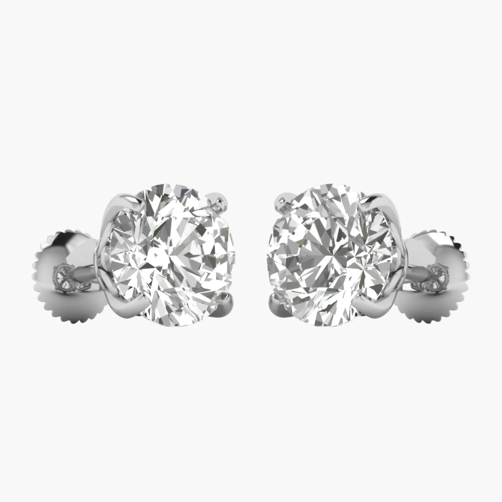 Pair of diamond stud earrings on a white background