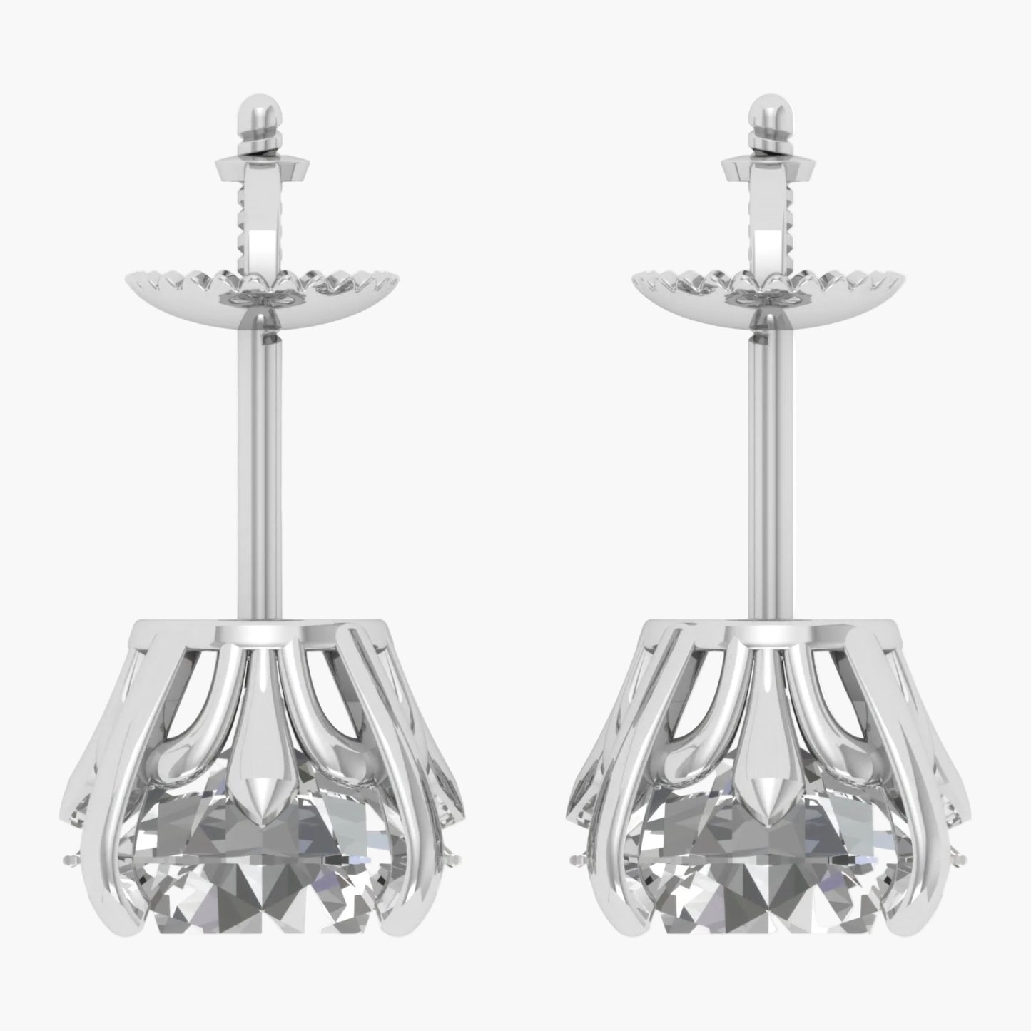 Pair of silver earrings with clear gemstones on a white background