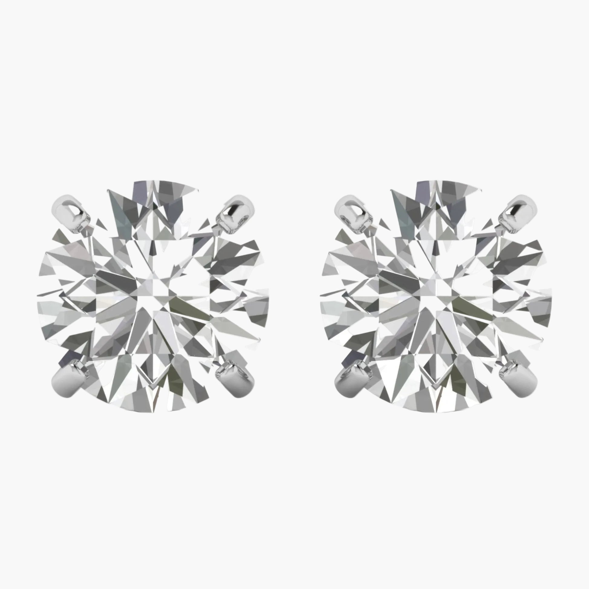 Pair of diamond stud earrings on a white background