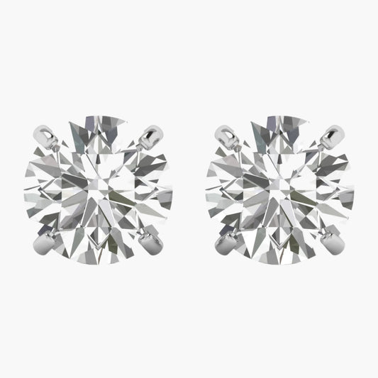 Pair of diamond stud earrings on a white background