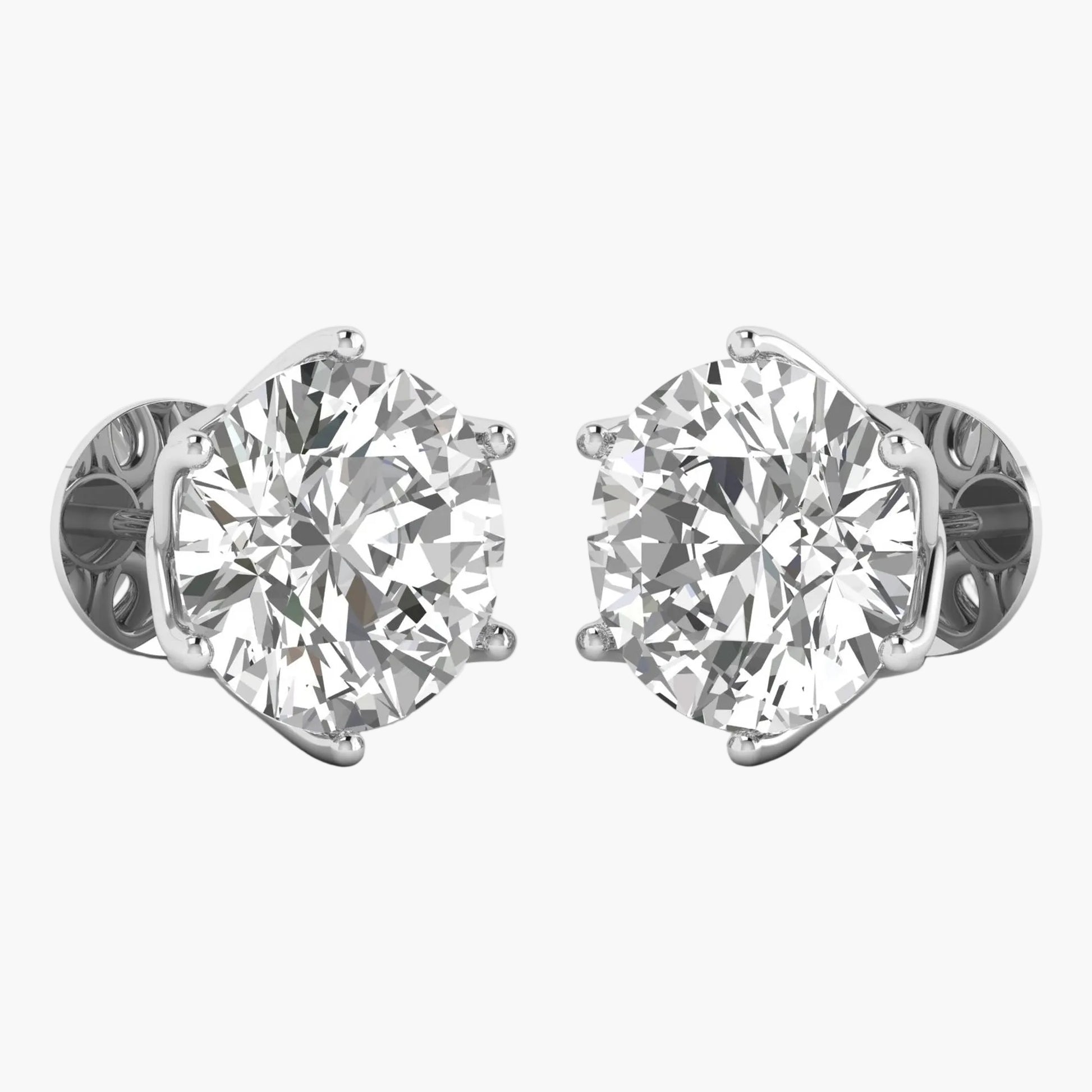 Pair of diamond stud earrings on a white background
