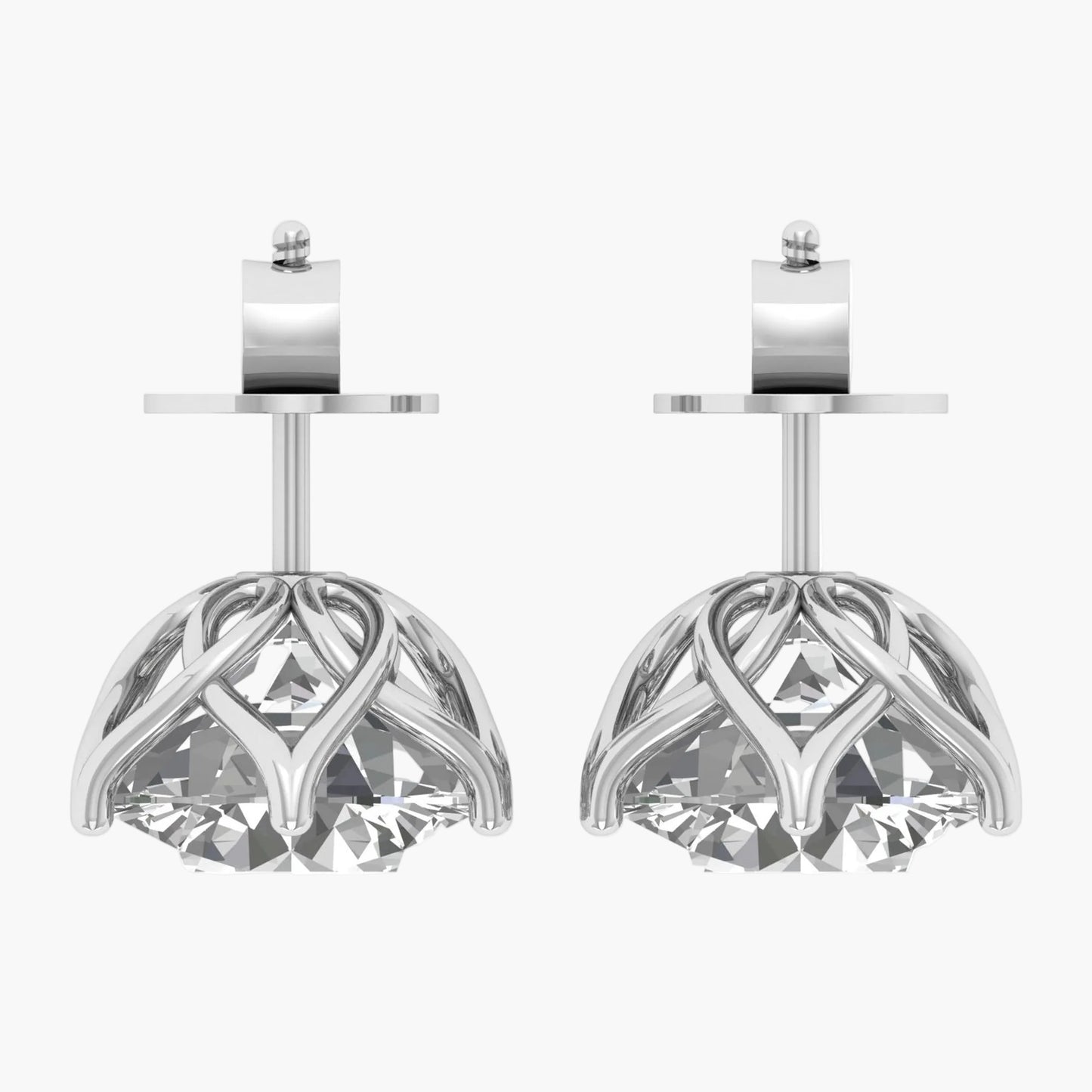 Pair of silver earrings with intricate designs on a white background