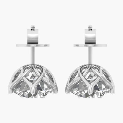 Pair of silver earrings with intricate designs on a white background
