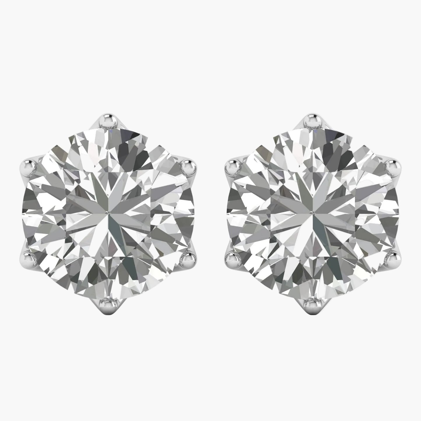 Pair of diamond stud earrings on a white background