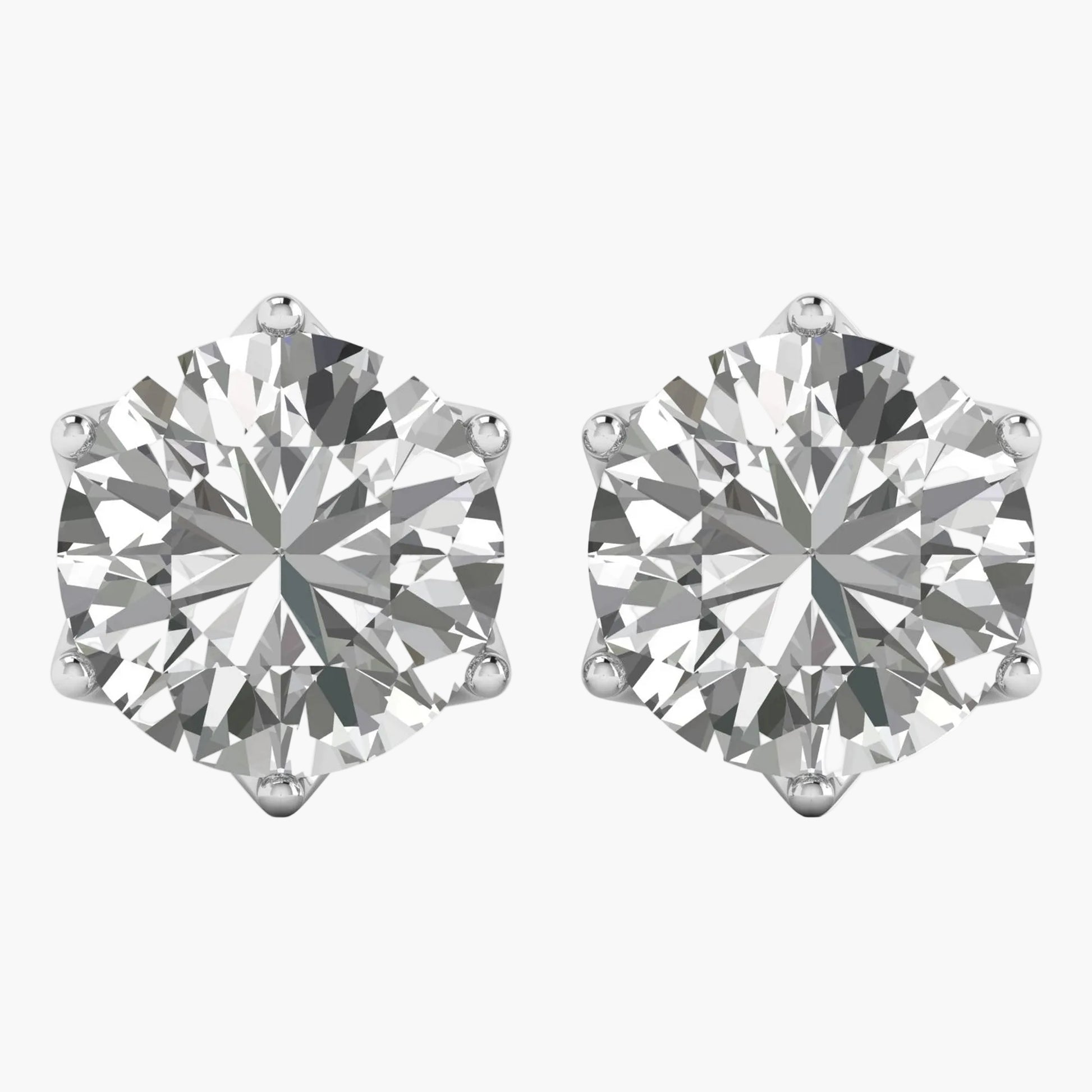 Pair of diamond stud earrings on a white background
