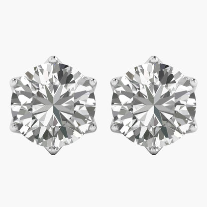 Pair of diamond stud earrings on a white background