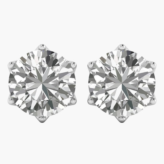 Pair of diamond stud earrings on a white background