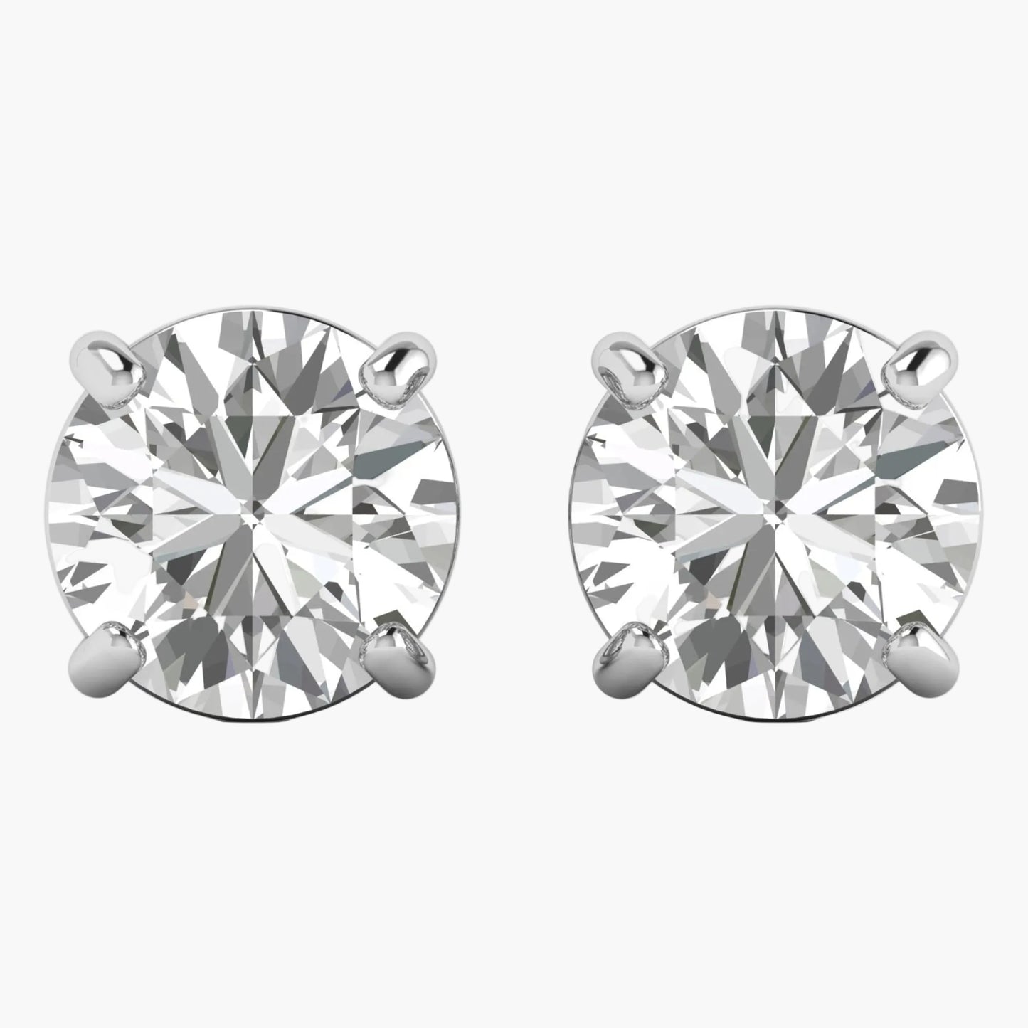 Pair of diamond stud earrings on a white background