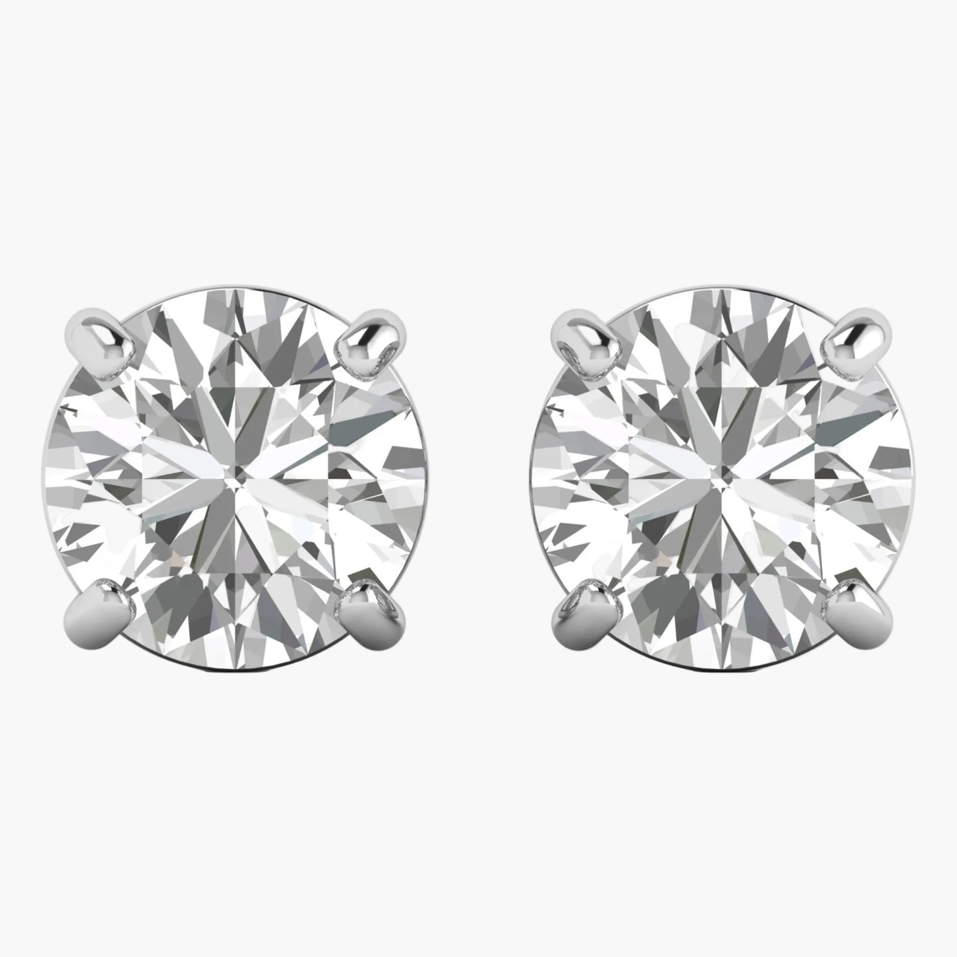 Pair of diamond stud earrings on a white background