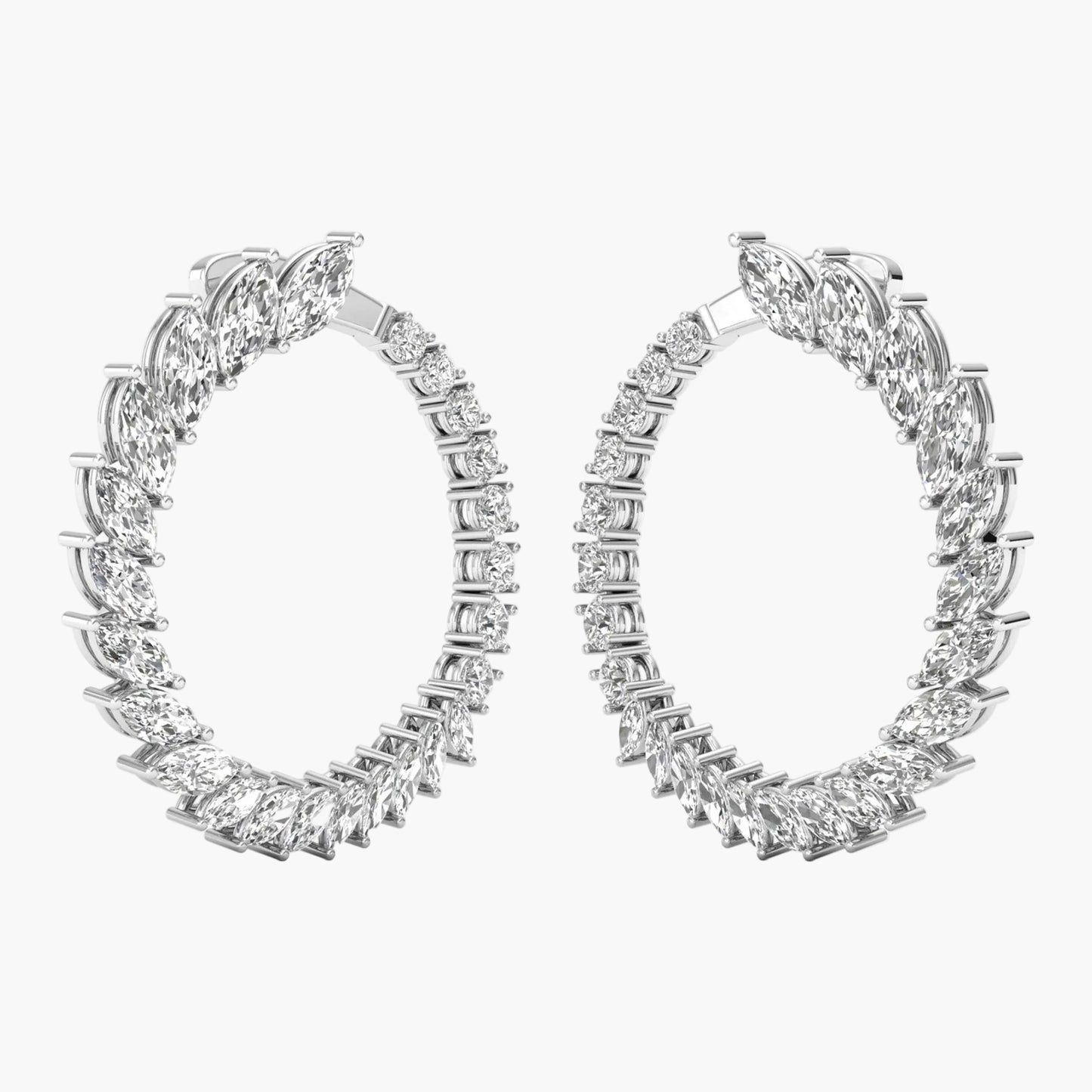 Pair of diamond hoop earrings on a white background