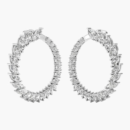 Pair of diamond hoop earrings on a white background