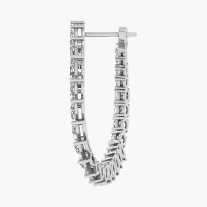 Silver hoop earrings with rectangular cut stones on a white background