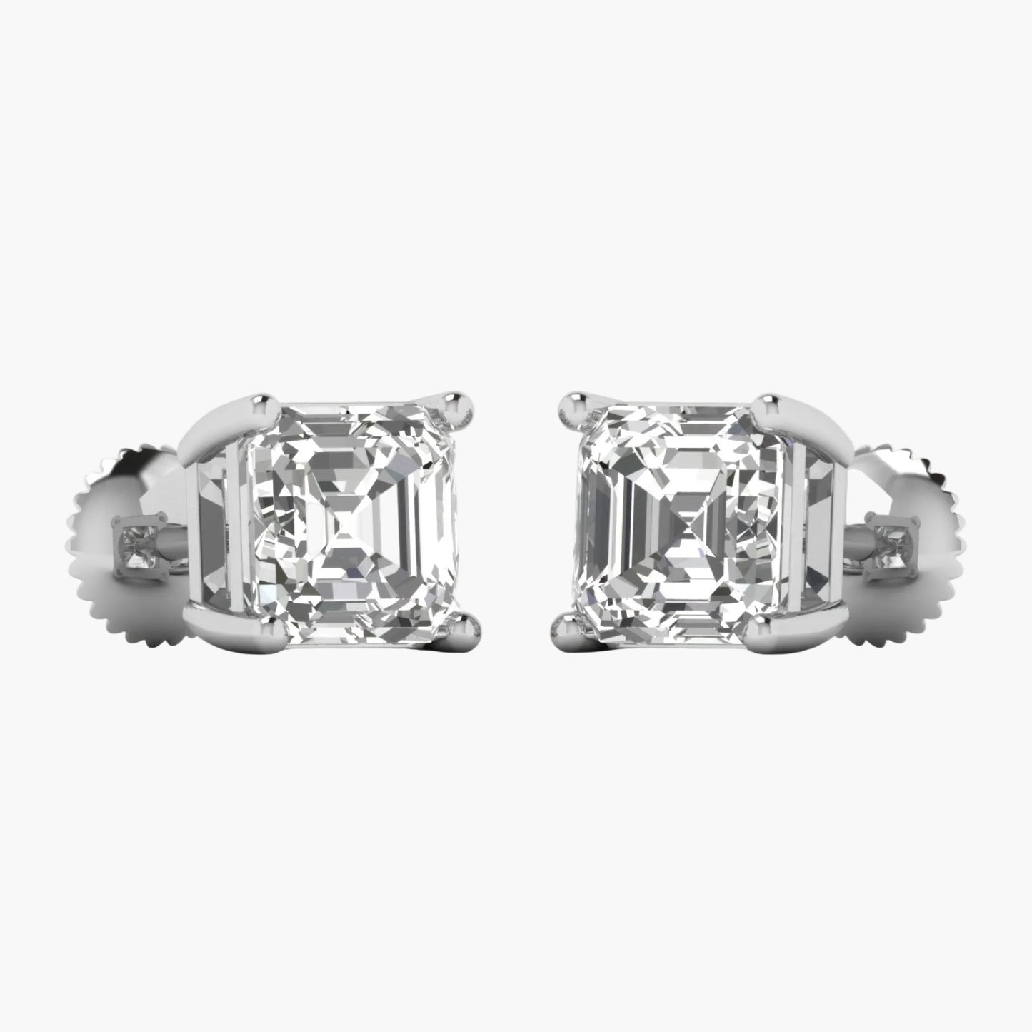 Pair of diamond stud earrings on a white background