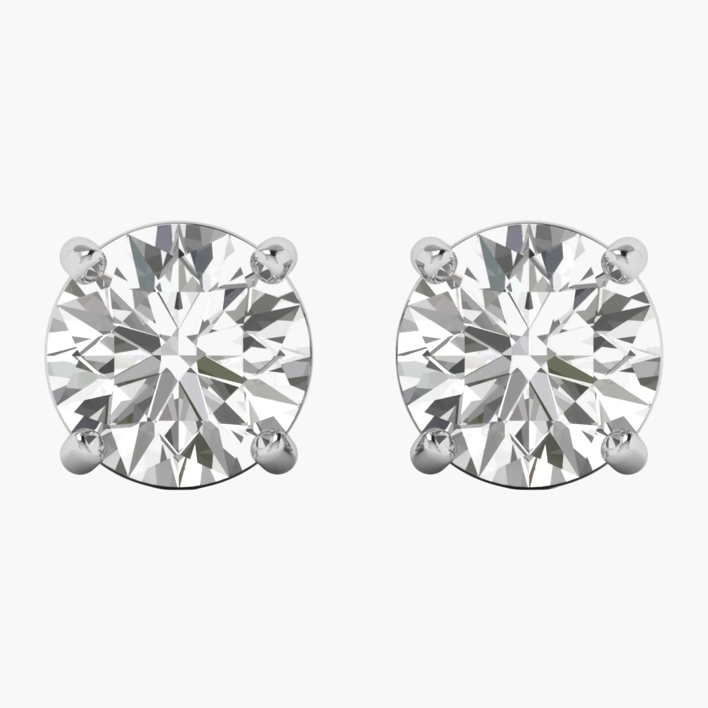 Pair of diamond stud earrings on a white background