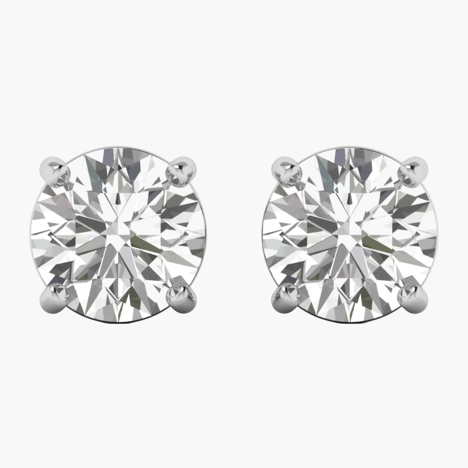 Pair of diamond stud earrings on a white background