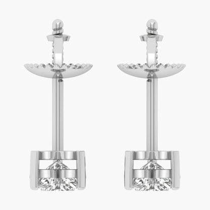 Pair of silver earrings with clear gemstones on a white background