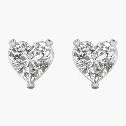Heart-shaped diamond earrings on a white background