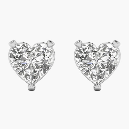 Heart-shaped diamond earrings on a white background