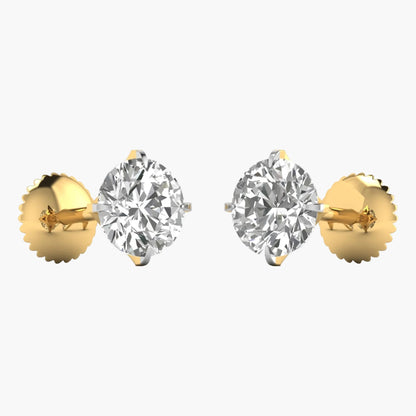 Pair of gold earrings with clear gemstones on a white background