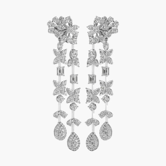 Elegant silver earrings with floral and butterfly designs on a white background