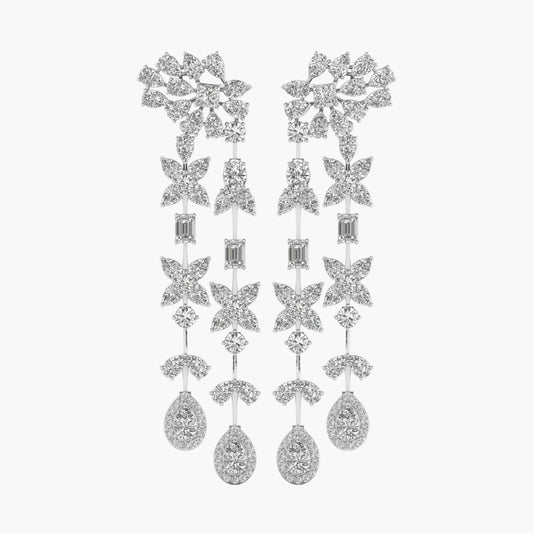 Pair of silver earrings with star-shaped designs on a white background