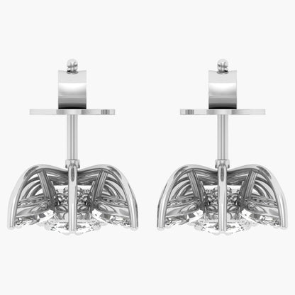Pair of silver earrings with intricate designs on a white background