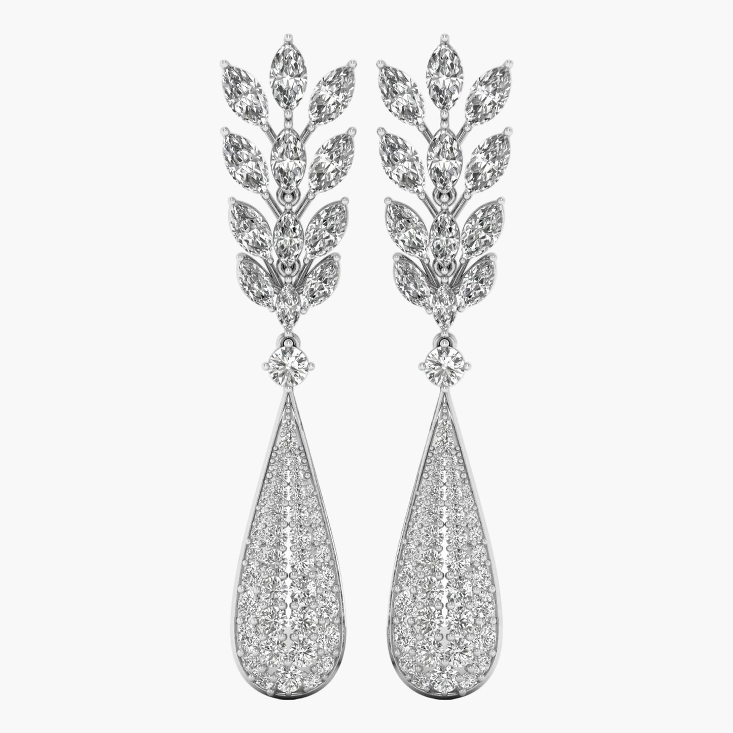 Pair of silver earrings with teardrop design and leaf-like top on a white background