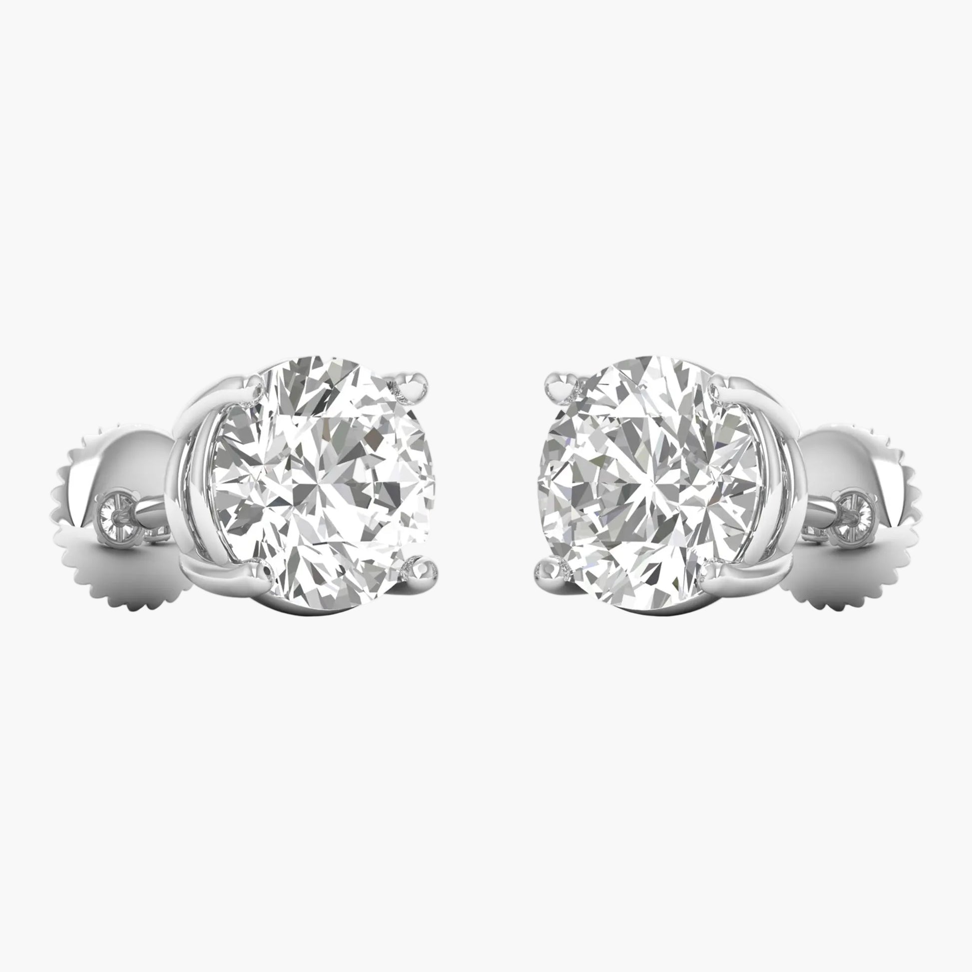 Pair of diamond stud earrings on a white background