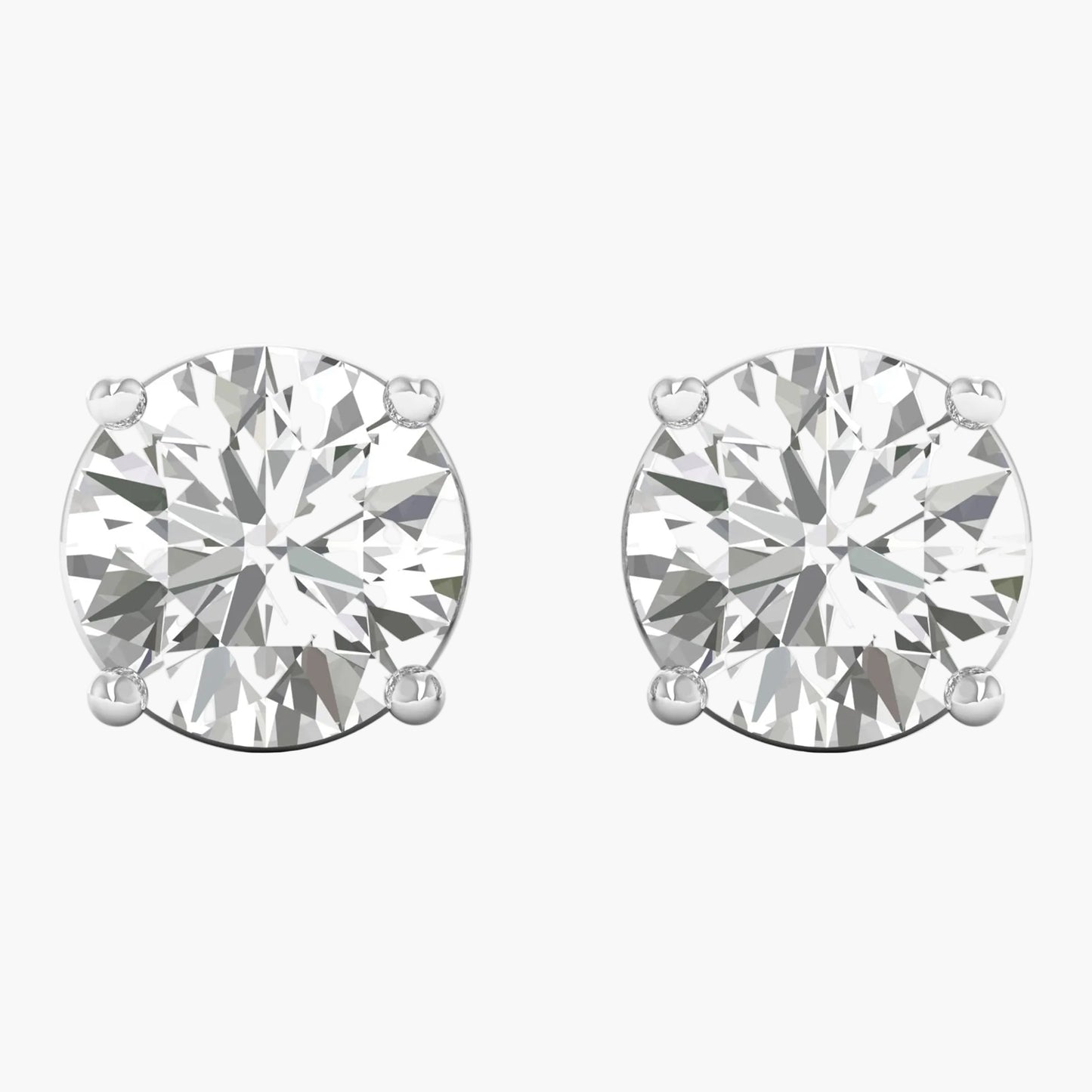 Pair of diamond stud earrings on a white background
