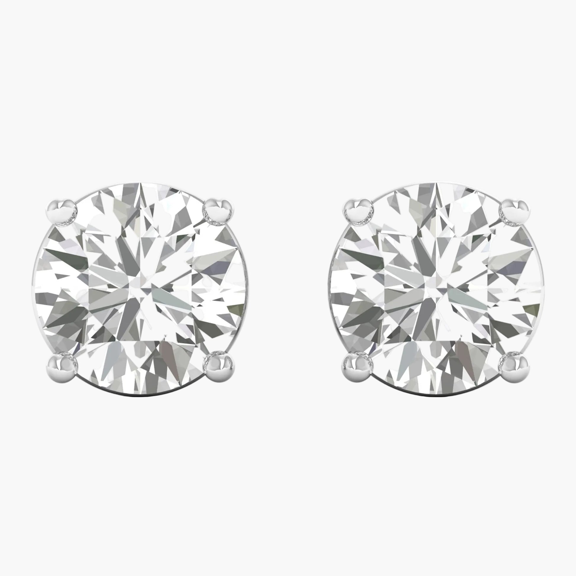 Pair of diamond stud earrings on a white background