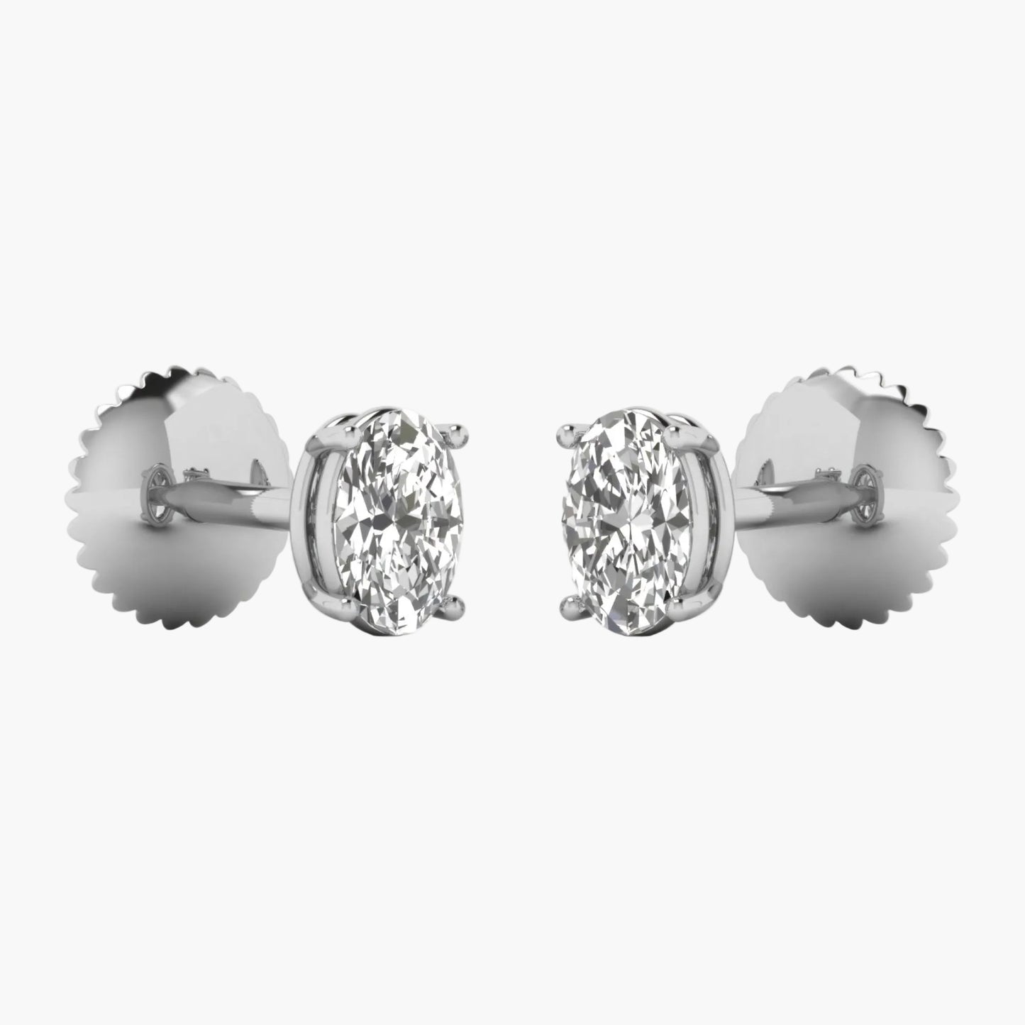 Pair of diamond stud earrings on a white background