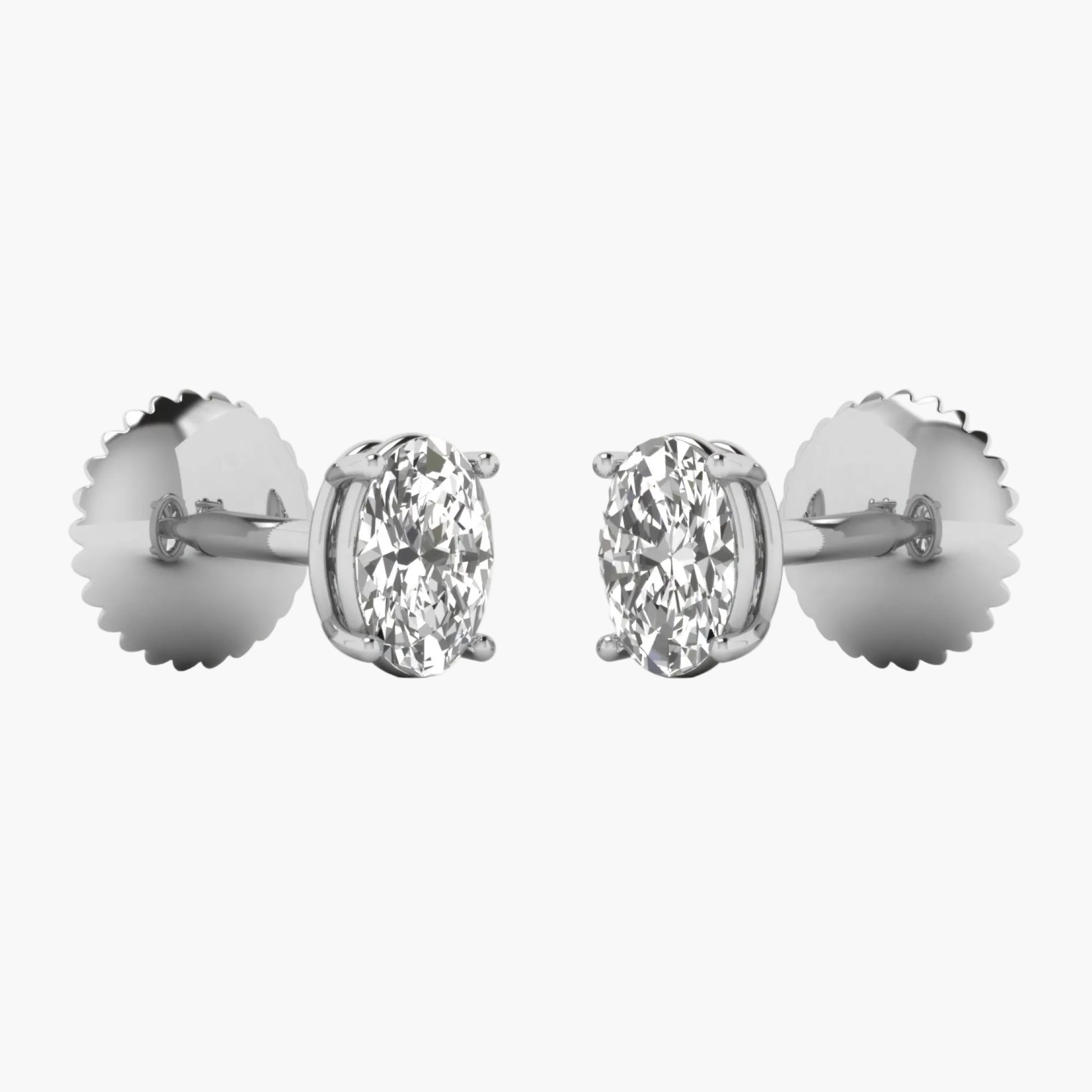 Pair of diamond stud earrings on a white background