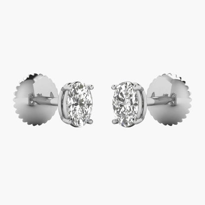 Pair of diamond stud earrings on a white background