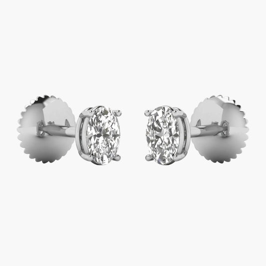 Pair of diamond stud earrings on a white background