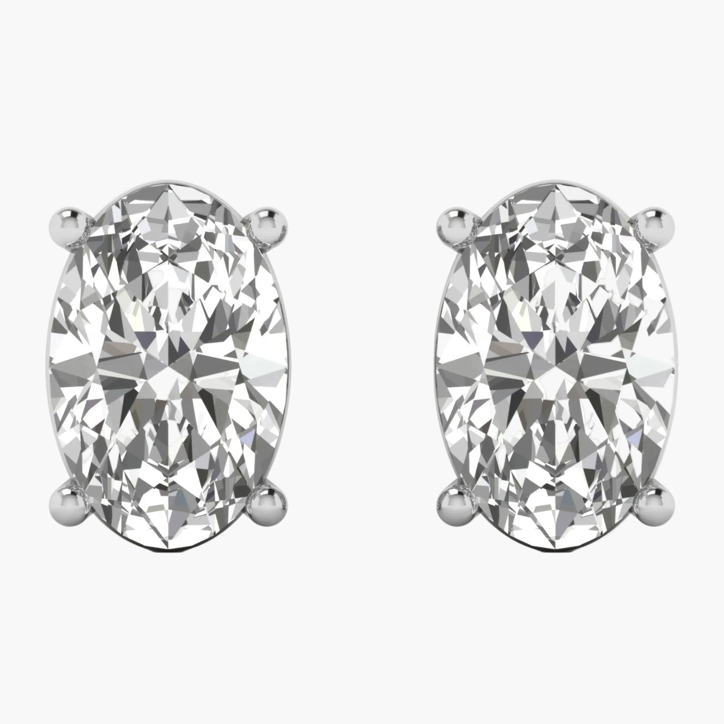 Pair of diamond stud earrings on a white background