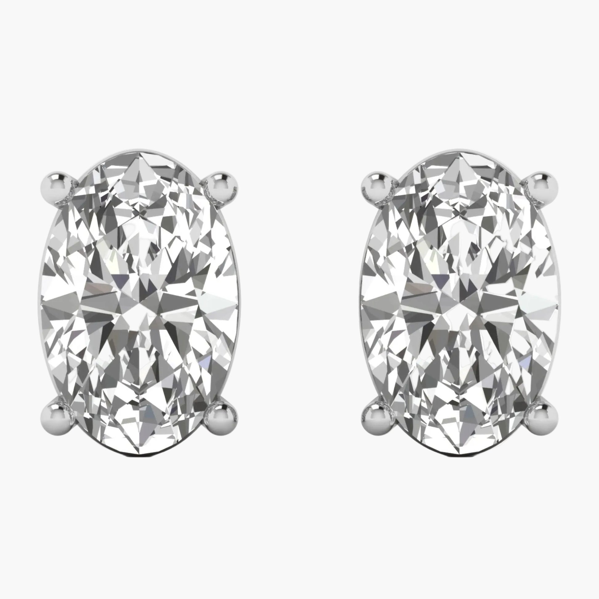 Pair of diamond stud earrings on a white background