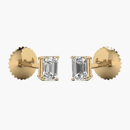 Gold earrings with emerald-cut diamonds on a white background