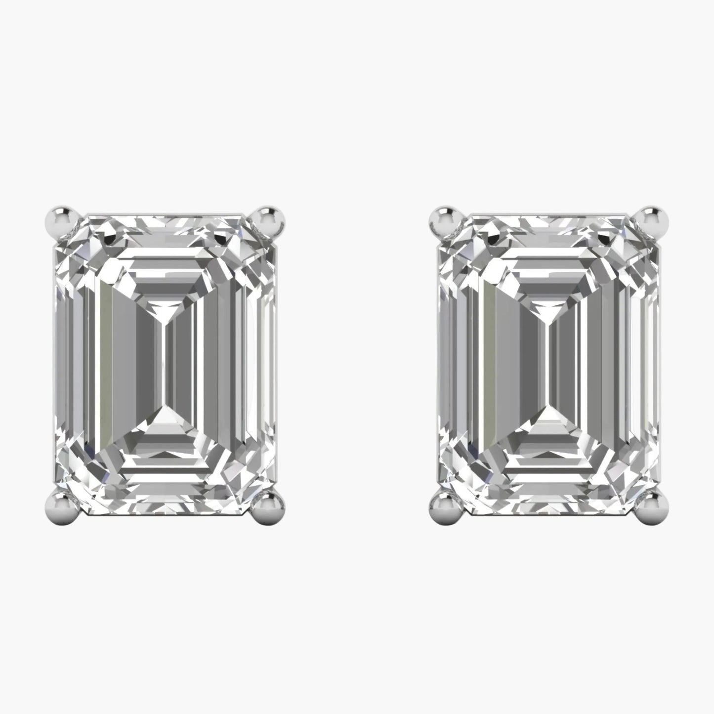Pair of diamond stud earrings on a white background