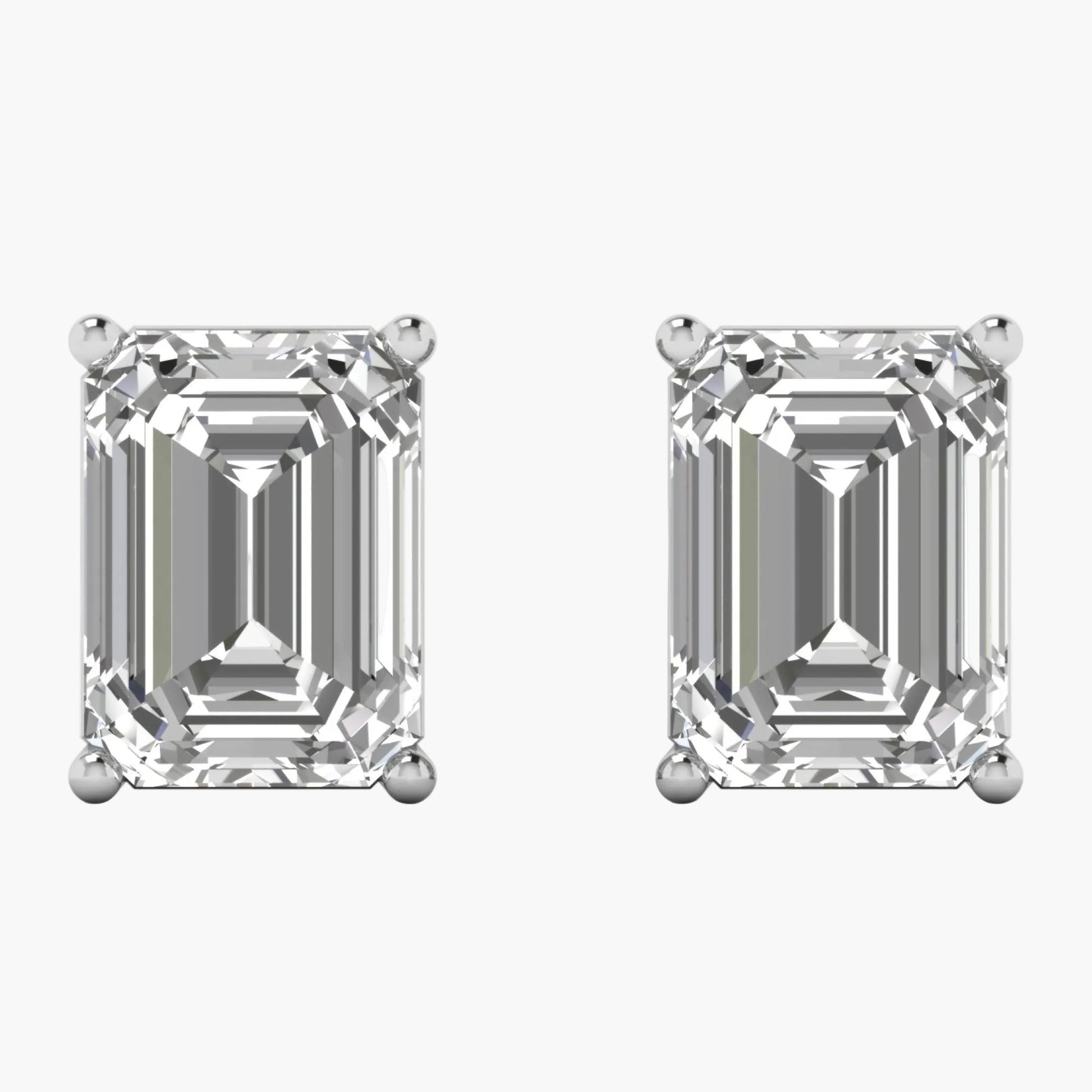 Pair of diamond stud earrings on a white background