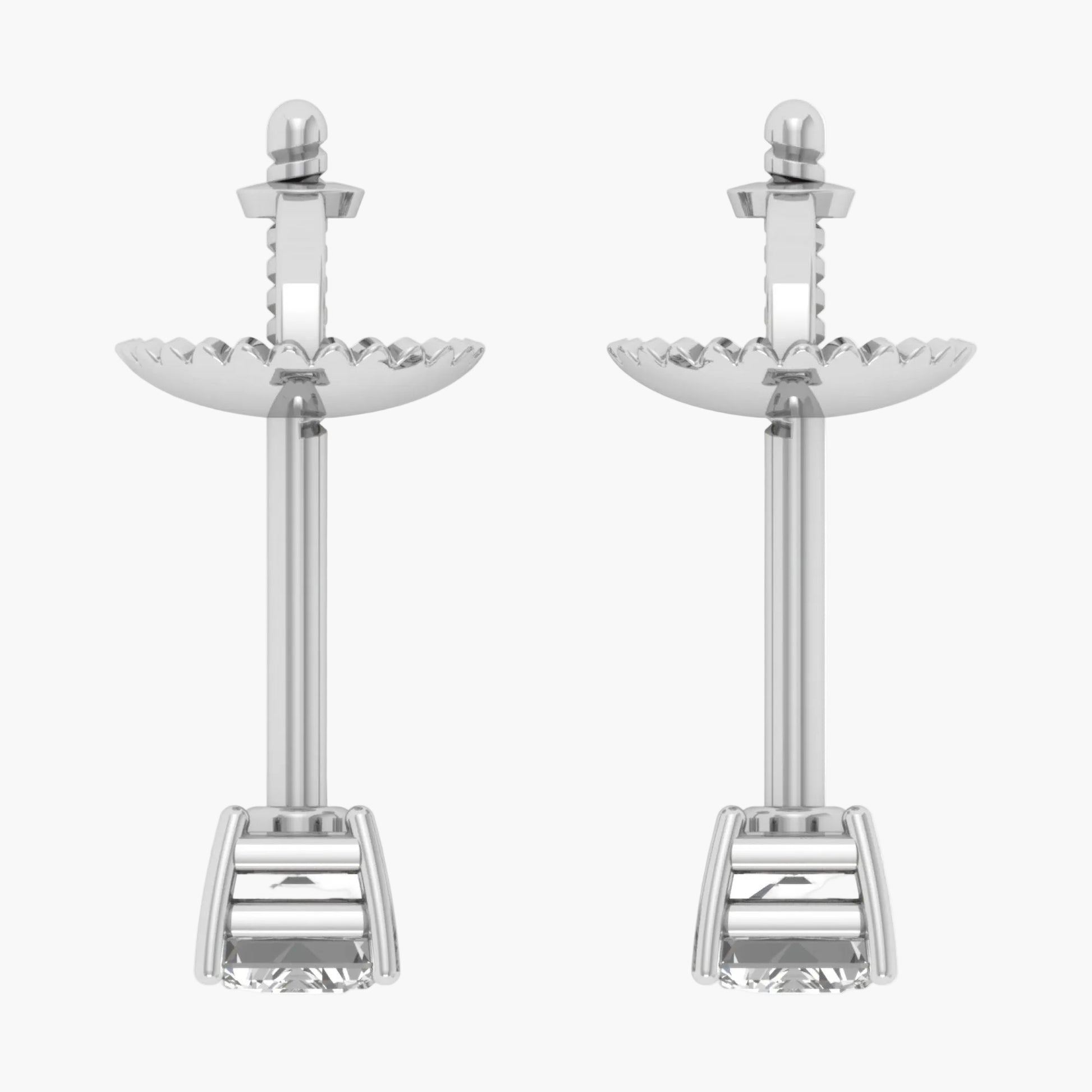 Pair of silver earrings with intricate designs on a white background