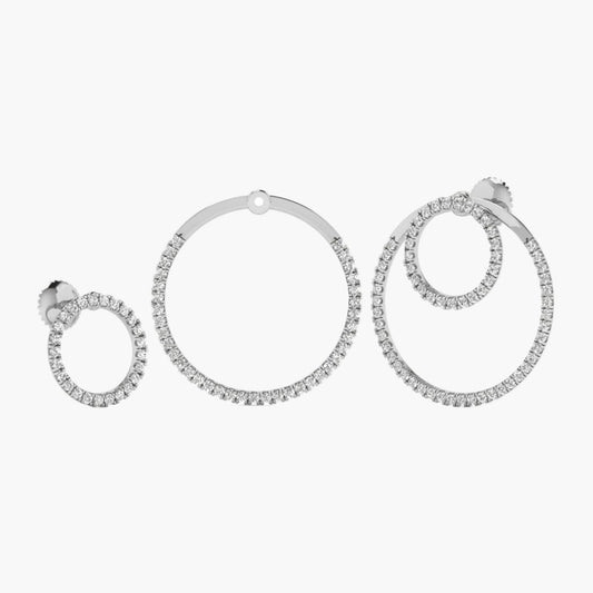 Set of silver hoop earrings with clear gemstones on a white background