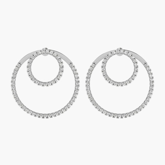Pair of silver hoop earrings with clear stones on a white background