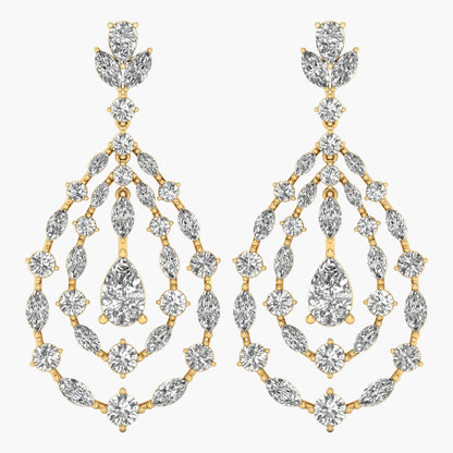 Gold and diamond earrings on a white background