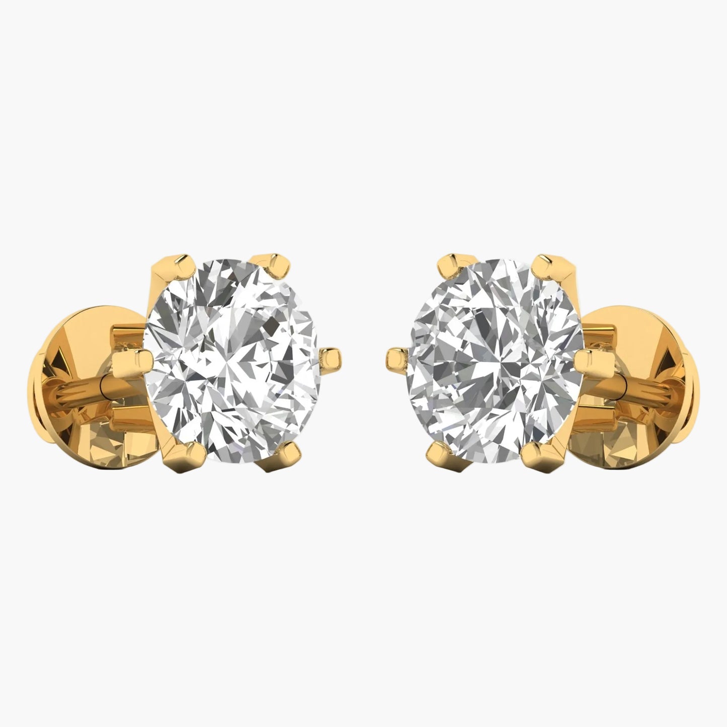 Gold earrings with clear gemstones on a white background