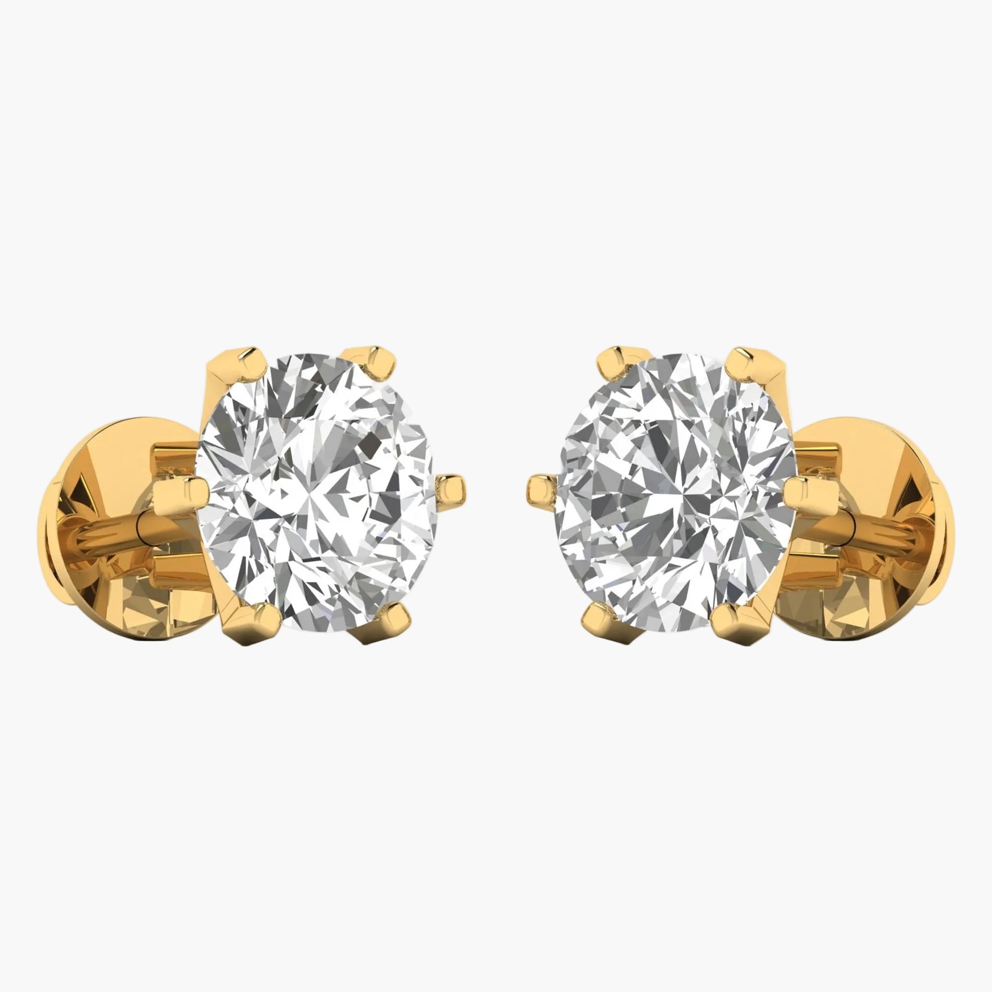 Gold earrings with clear gemstones on a white background