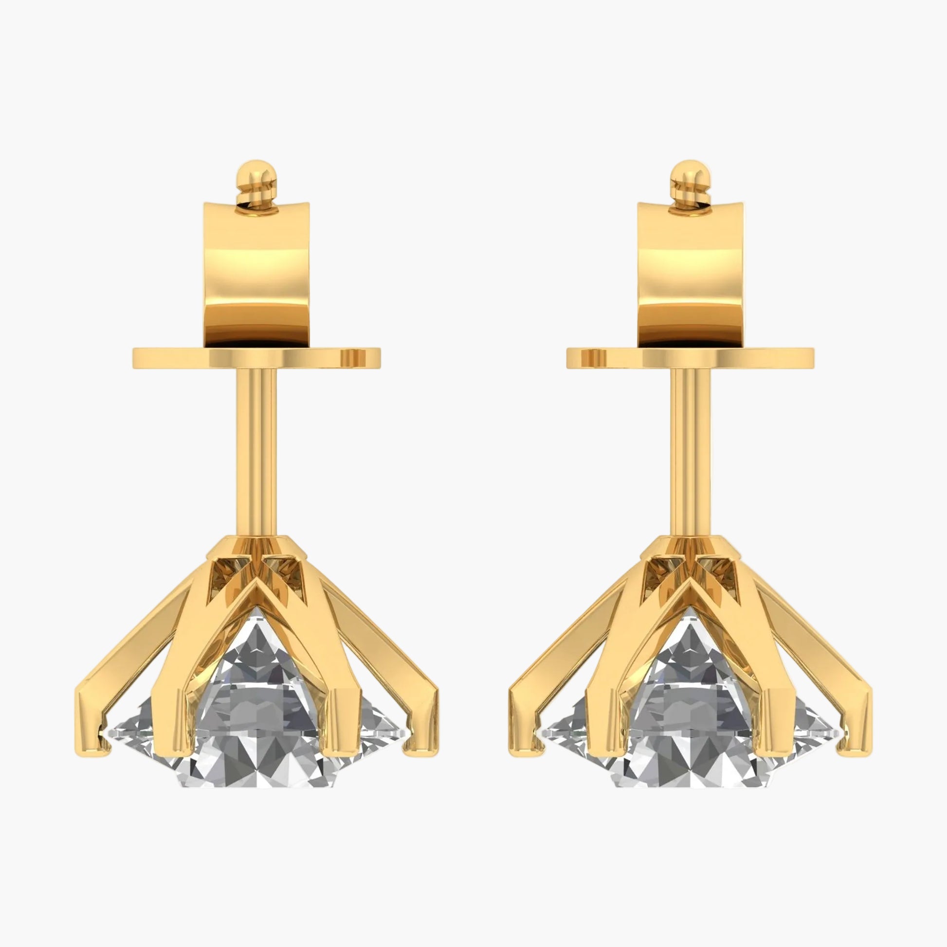 Gold earrings with clear gemstones on a white background
