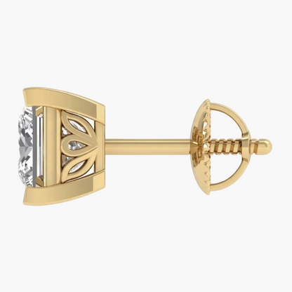 A single yellow gold stud earring with a round-cut clear gemstone in a decorative bezel setting, shown from the side on a plain white background.