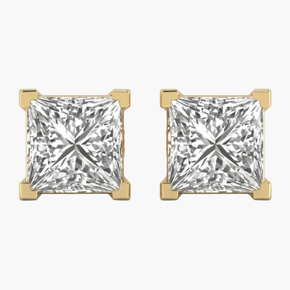 Pair of gold earrings with square-cut gemstones on a white background